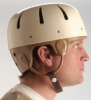 Humane restraint hard shell helmet